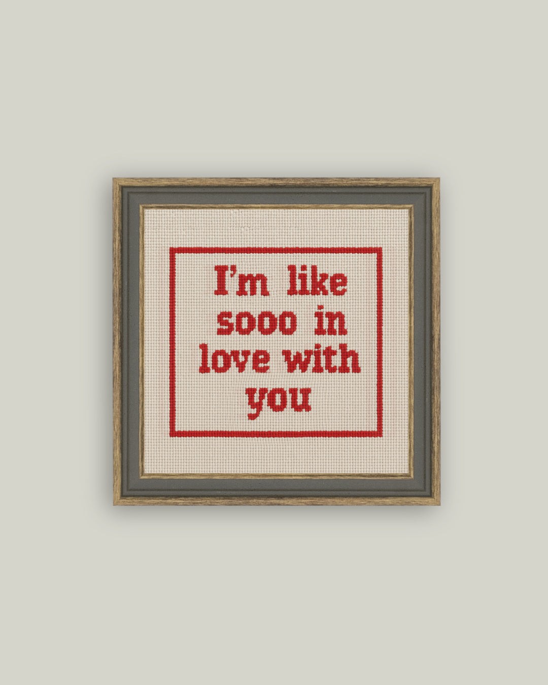 Cross stitch style love quote canvas art in gray-brown frame
