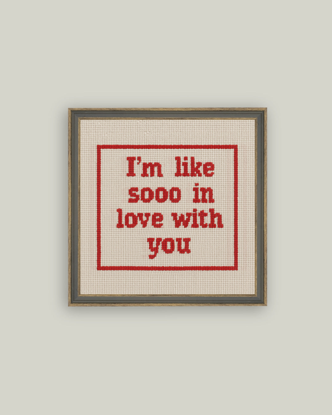 Cross stitch style love quote canvas art in gray-brown frame