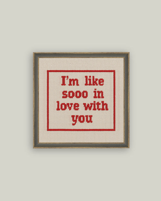 Cross stitch style love quote canvas art in gray-brown frame