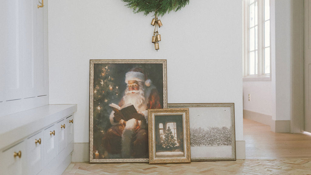 Living room with framed Christmas artworks and holiday decor