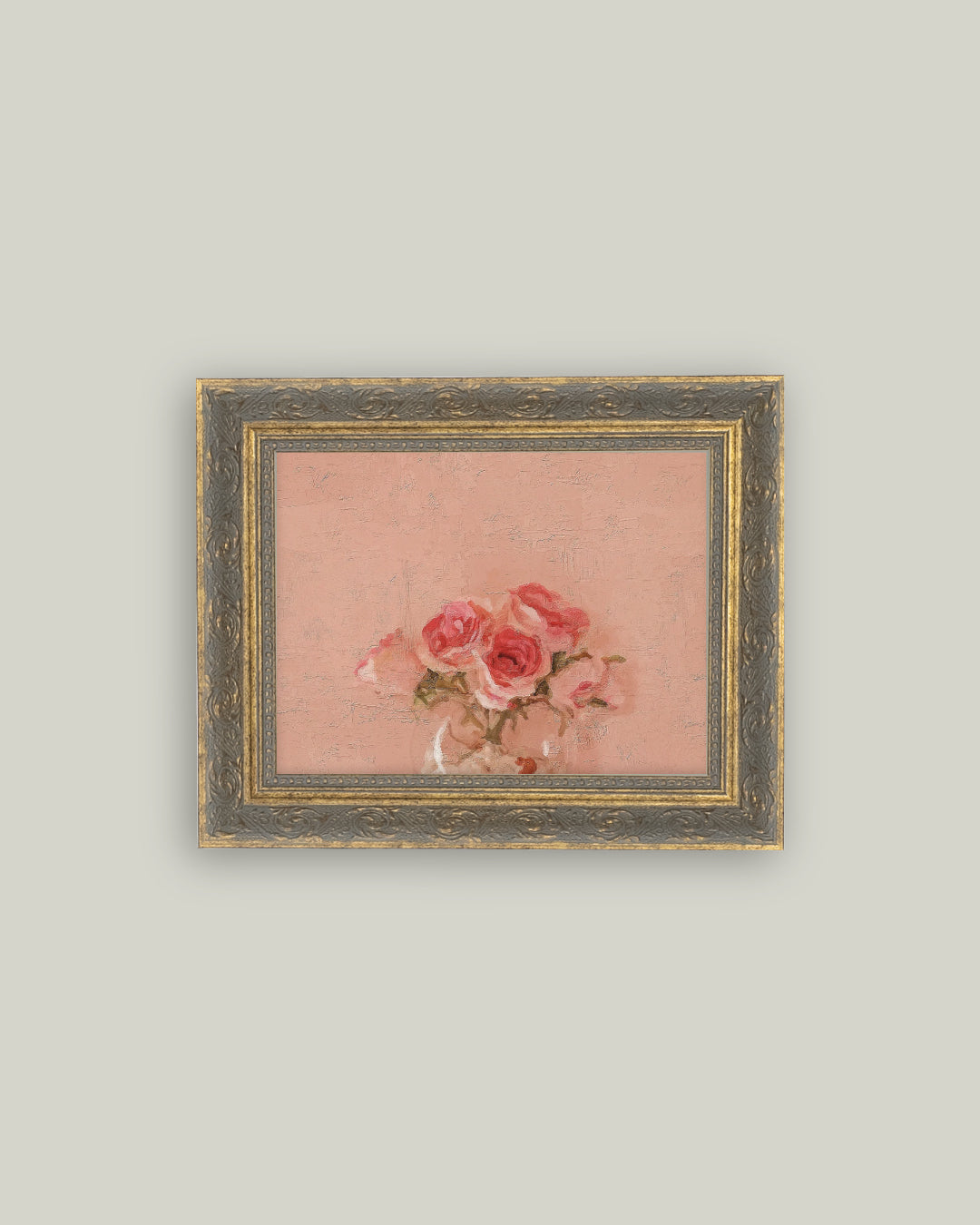 A canvas print of pink roses within a antique framed border.